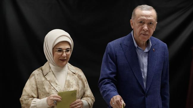 Turkish President Recep Tayyip Erdogan and his wife Emine Erdogan arrive at a polling station to cast their vote during the Turkish presidential election run-off. Picture: Getty Images