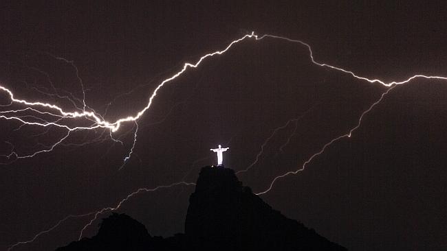 Top shot ... The Christ the Redeemer lost it's right hand in the scary weather. Picture: AFP