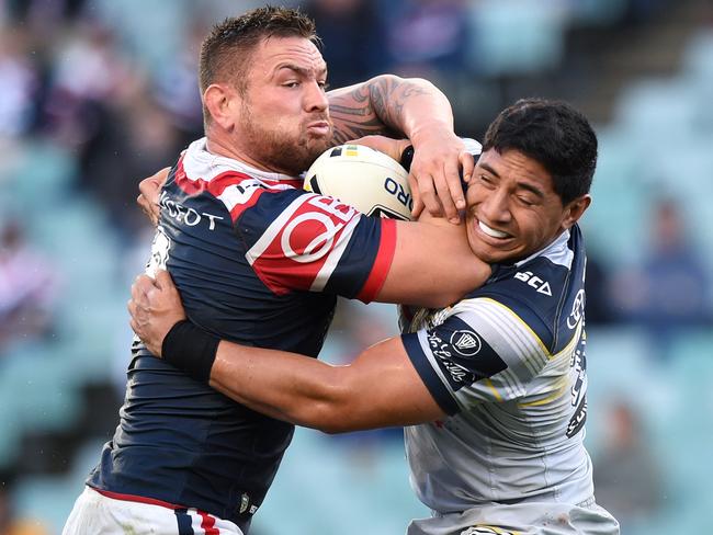 Jared Waerea-Hargreaves (left) of the Roosters is tackled by Jason Taumalolo of the Cowboys during the round 23 NRL match between the Sydney Roosters and the North Queensland Cowboys at Allianz Stadium in Sydney on Sunday, Aug. 14, 2016. (AAP Image/Paul Miller) NO ARCHIVING, EDITORIAL USE ONLY