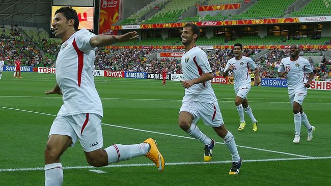 MELBOURNE, AUSTRALIA - JANUARY 16: Hamza Al Dardour of Jordan celebrates after he scored his third goal of the match during the 2015 Asian Cup match between Palestine and Jordan at AAMI Park on January 16, 2015 in Melbourne, Australia. (Photo by Robert Cianflone/Getty Images)