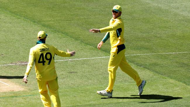 Macca Harvey (right) sub fielding for Australia. (Photo by Martin Keep)