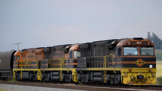 About 12 coal trains a day will pass Algester, Parkinson and Acacia Ridge homes as part of the Inland Rail realignment. Photo: AAP/Dan Himbrechts