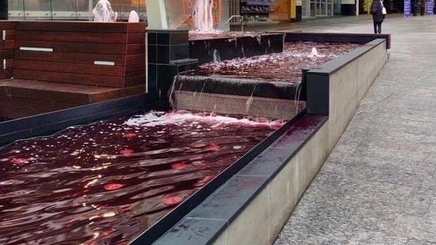 A fountain in Brisbane’s Queen Street Mall was also dyed red. Picture: Facebook