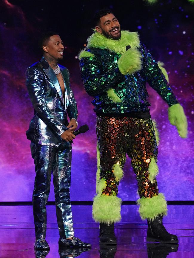 Host Nick Cannon and NFL player Jordan Mailata on The Masked Singer. Picture: FOX via Getty Images