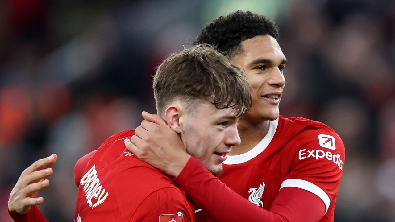 LIVERPOOL, ENGLAND - JANUARY 28: Conor Bradley and Jarell Quansah of Liverpool celebrate as Ryan Gravenberch of Liverpool (not pictured) scores his team's fifth goal during the Emirates FA Cup Fourth Round match between Liverpool and Norwich City at Anfield on January 28, 2024 in Liverpool, England. (Photo by Clive Brunskill/Getty Images)