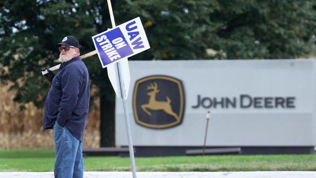 A striking worker pickets outside the John Deere Davenport Works facility in Davenport, Iowa on October 15. Picture: Scott Olson/AFP