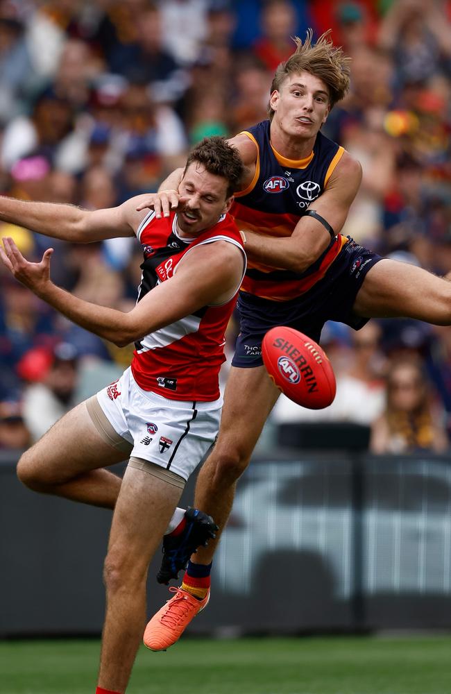 Josh Worrell flies over Zaine Cordy at the Adelaide Oval. Picture: Michael Willson/AFL Photos via Getty Images)