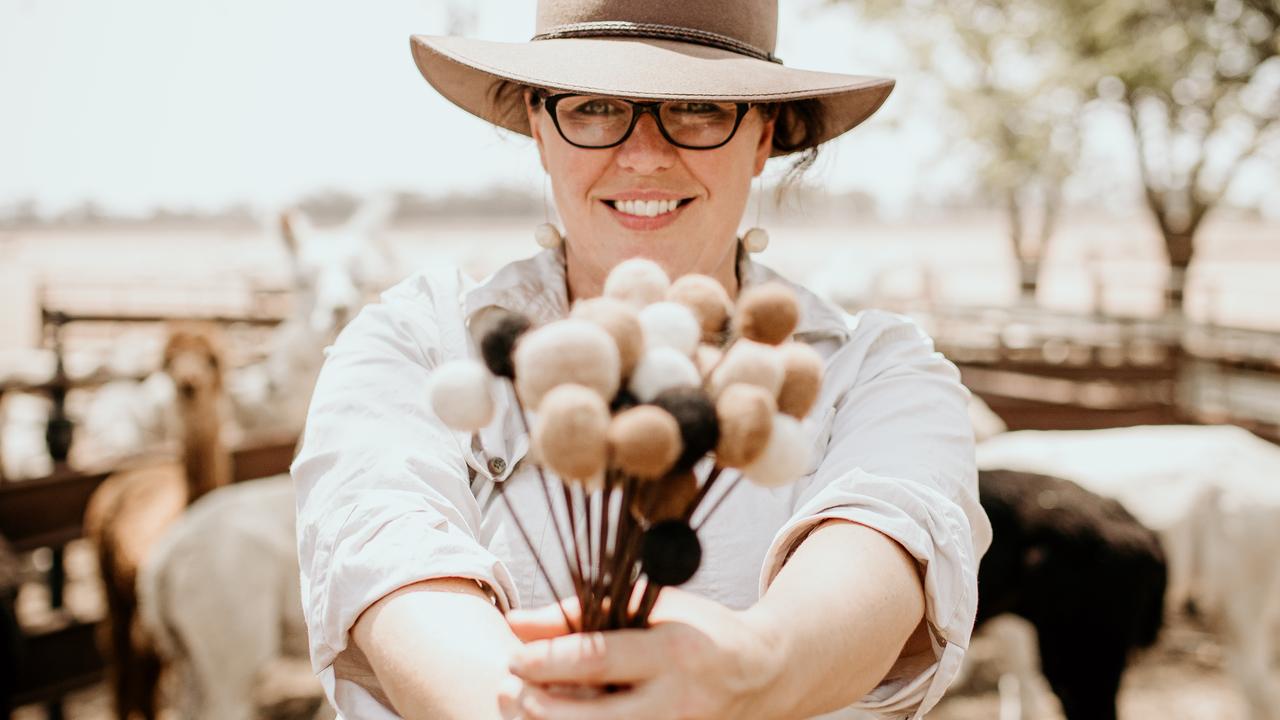 Amee Dennis with her handmade flowers made from alpaca wool. Picture: Nicole Drew Photography