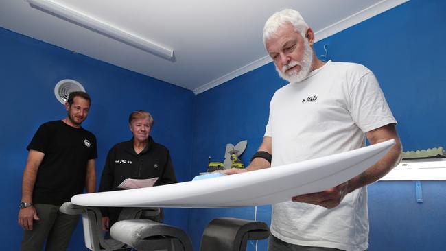 Surfboard shaping with revenue manager Justin Koen, surfing legend Wayne Rabbit Bartholomew and shaper Dave Verrall, at S-LAB at Surfboard Warehouse, Miami . Picture: Glenn Hampson