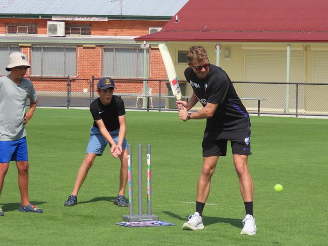 Hurricanes fans watch on as player Riley Meredith bats at Tuesday's fan day in Launceston. Picture: Jon Tuxworth