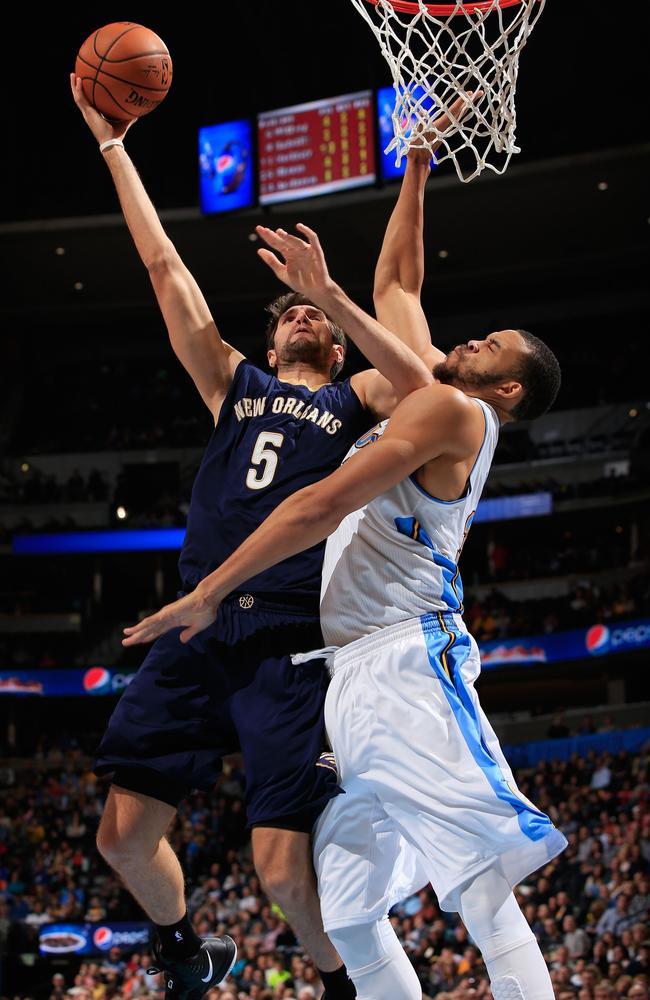 Jeff Withey #5 of the New Orleans Pelicans takes a shot and is fouled by JaVale McGee #34.