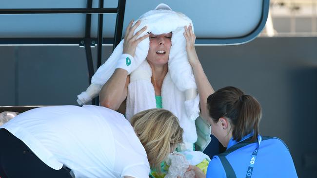 Alize Cornet gets medical treatment to combat heat stress. Photo: AAP