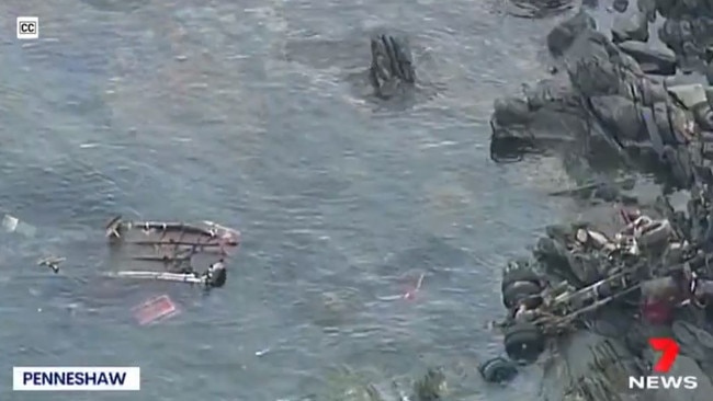 A screengrab of drone video showing the truck’s trailer in the water, and the wreckage to the right. Picture: 7NEWS