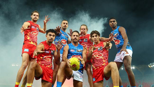 (Back L-R) Jy Farrar, Joel Jeffrey, Jed Anderson, Lloyd Johnston. (Front L-R) Malcolm Rosas, Ben Long and Sean Lemmens pose with the Gold Coast Suns AFL Indigenous Guernsey ahead of Sir Doug Nicholls Round. (Photo by Chris Hyde/Getty Images)