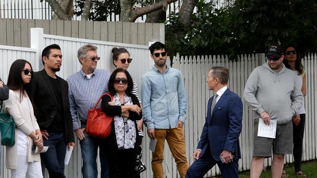 Bidders at a house auction in Albion. Picture: Steve Pohlner