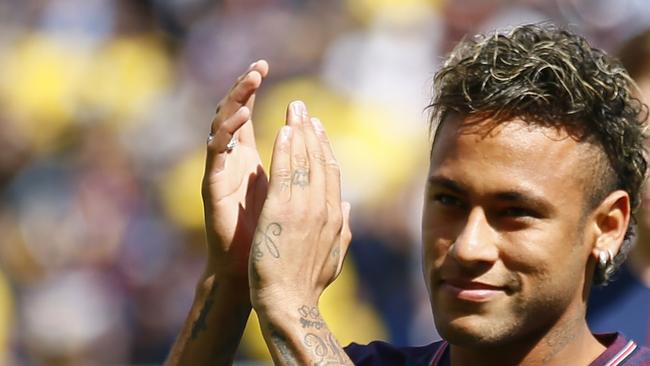 Neymar applauds his fans at the Parc des Princes stadium.