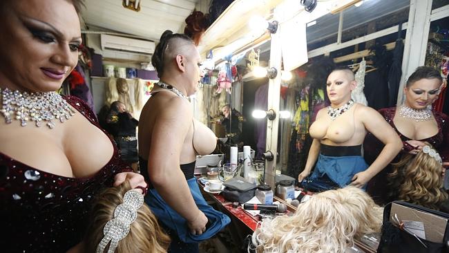 Dancers change costumes during a break in their show in Mayak.