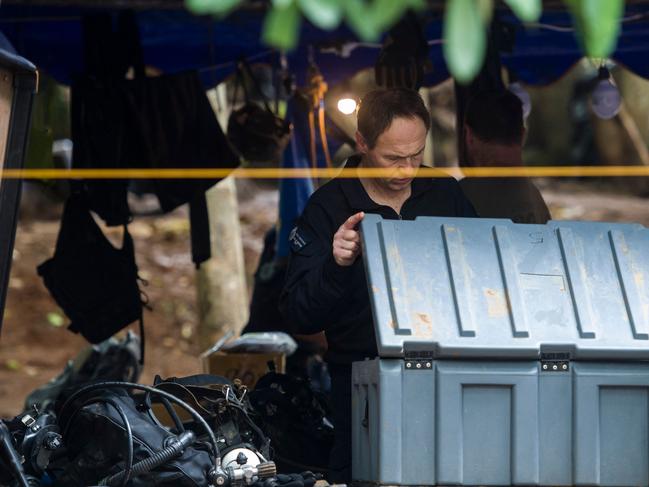 Members of the Australian Federal Police rescue team check their equipment and oxygen tanks as rescue operations continue. Picture: AFP