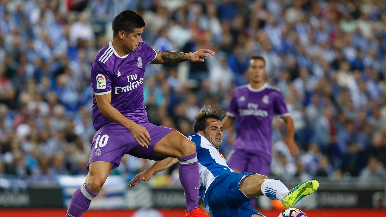 New Western United signing Victor Sanchez tackles then Real Madrid star James Rodriguez while playing for Espanyol in 2016. Picture: AFP PHOTO/ PAU BARRENA