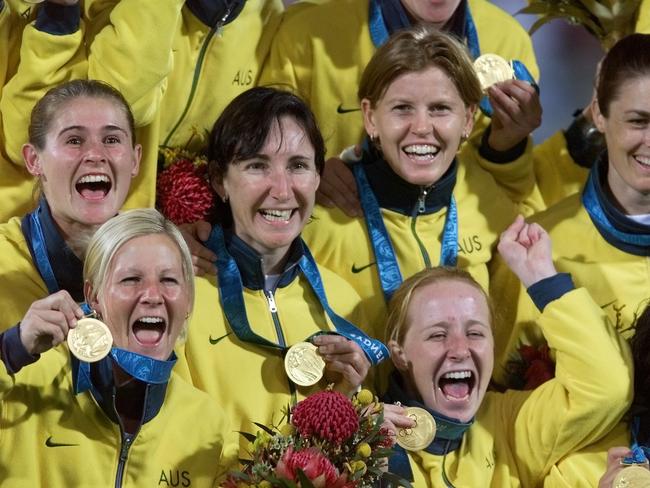 SEPTEMBER 29, 2000 : Hockeyroos players show off their gold medals after medal presentation after Australia defeated Argentina in Sydney Olympic Games final at Homebush, 29/09/00. Pic Jay Town.HockeySydney2000