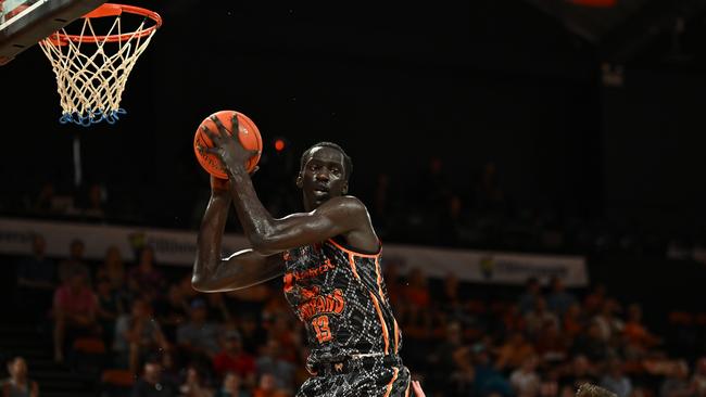 CAIRNS, AUSTRALIA - JANUARY 13: Akoldah Gak of the Taipans catches the rebound during the round 15 NBL match between Cairns Taipans and Adelaide 36ers at Cairns Convention Centre, on January 13, 2024, in Cairns, Australia. (Photo by Emily Barker/Getty Images)