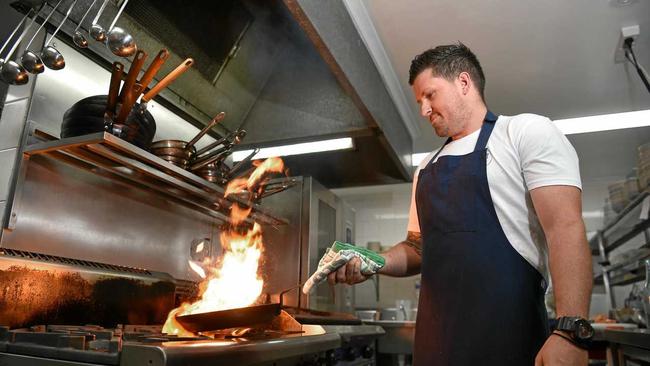 BUSY: Pier 33 chef Simon Campbell working in the kitchen. Picture: Warren Lynam