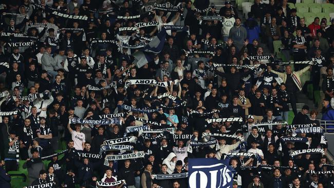 MELBOURNE, AUSTRALIA - APRIL 27:  Victory supporters hold up their scarves in the crowd during the A-League Men round 26 match between Melbourne Victory and Western Sydney Wanderers at AAMI Park, on April 27, 2024, in Melbourne, Australia. (Photo by Robert Cianflone/Getty Images)
