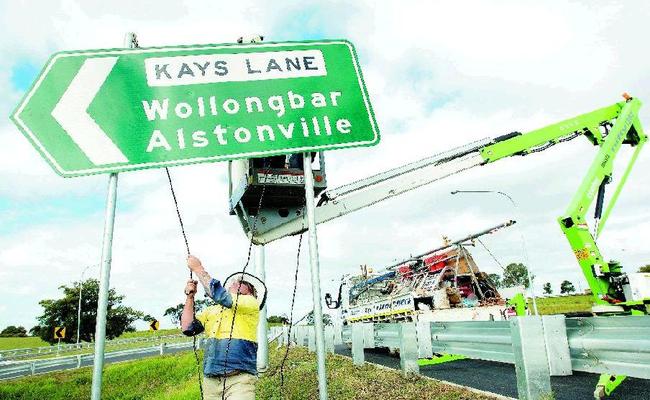 Workers put the finishing touches to the Alstonville bypass before today's official opening. . Picture: Jay Cronan