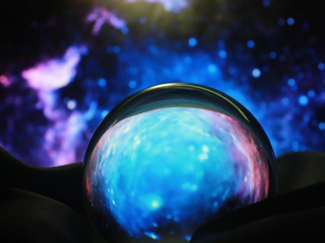 Astrological background. Crystal ball with predictions. Horoscope of the stars. Fortune telling and determination fate. Soothsayer with a crystal ball.