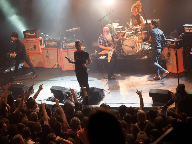 TO GO WITH AFP STORY BY ANTHONY LUCAS (FILES) This file photo taken on November 13, 2015 shows US rock group Eagles of Death Metal performing on stage on November 13, 2015 at the Bataclan concert hall in Paris, few moments before four men armed with assault rifles and shouting 
