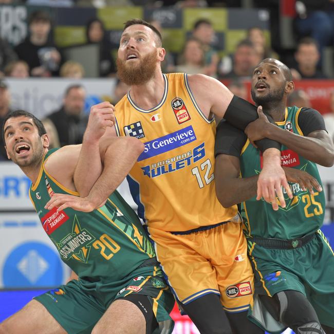 Aaron Baynes of the Brisbane Bullets (middle) contests a rebound against JackJumpers players Fabijan Krslovic (left) and Milton Doyle at MyState Bank Arena on October 9, 2022. Picture: Simon Sturzaker/Getty Images