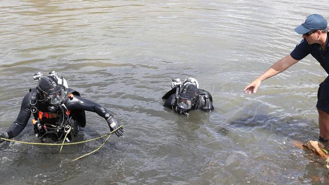 Police divers enter the Pimpama River in search for clues for murder of Tiahleigh Palmer. Photo: Regi Varghese