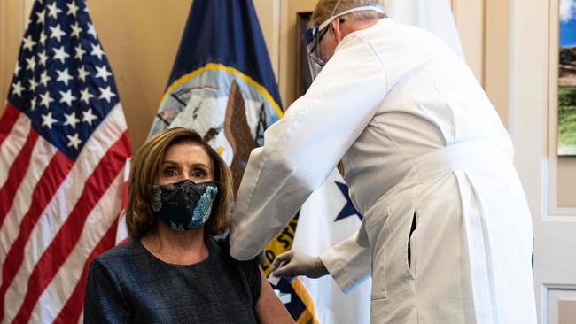 House Speaker Nancy Pelosi receives a Covid-19 vaccination shot by doctor Brian Monahan, attending physician Congress of the United States in her office on Capitol Hill.