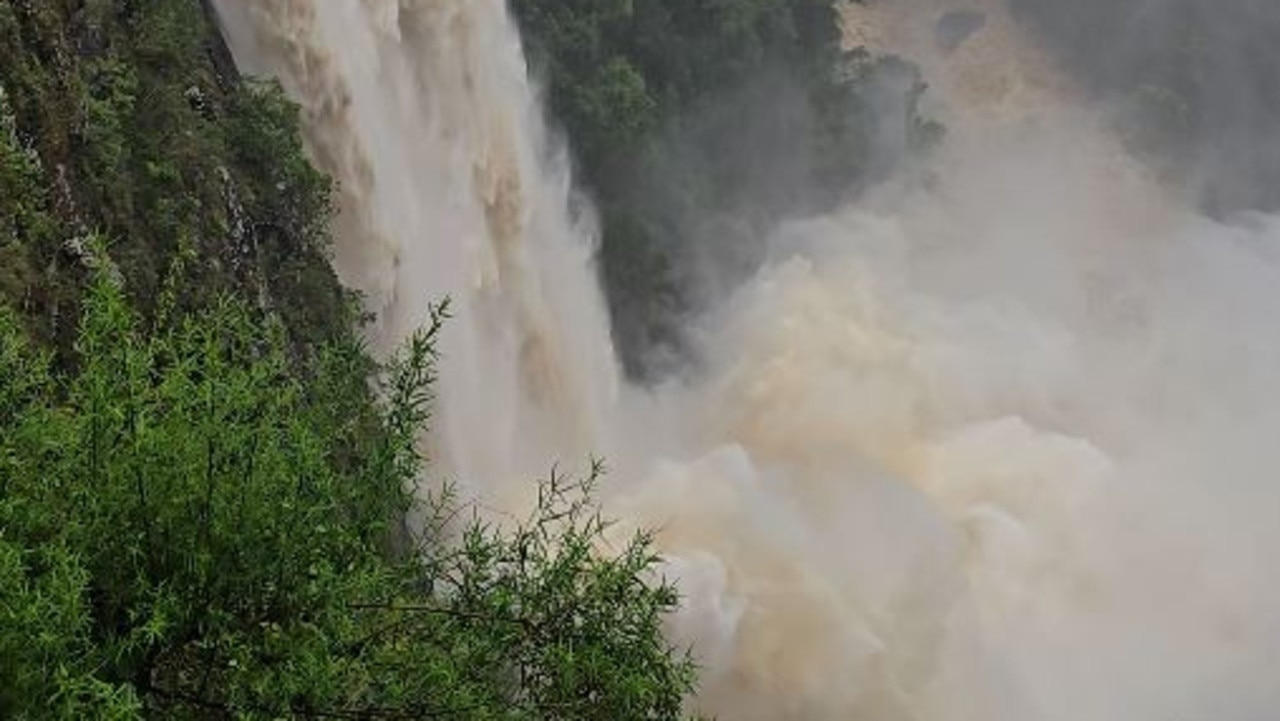 Incredible waterfall overflow as rainbomb descends on NSW