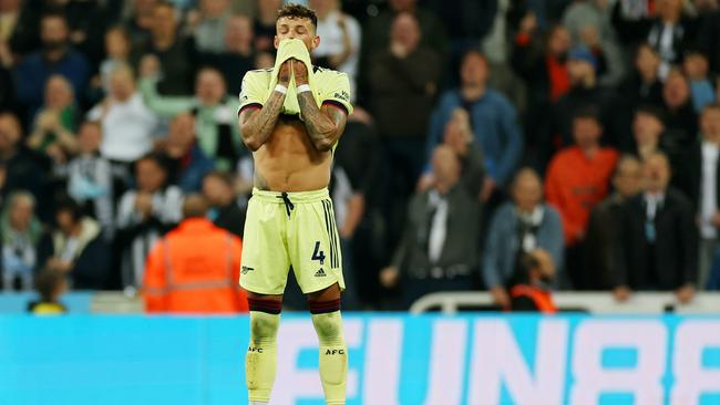 Ben White looks dejected after scoring an own goal. (Photo by Ian MacNicol/Getty Images)