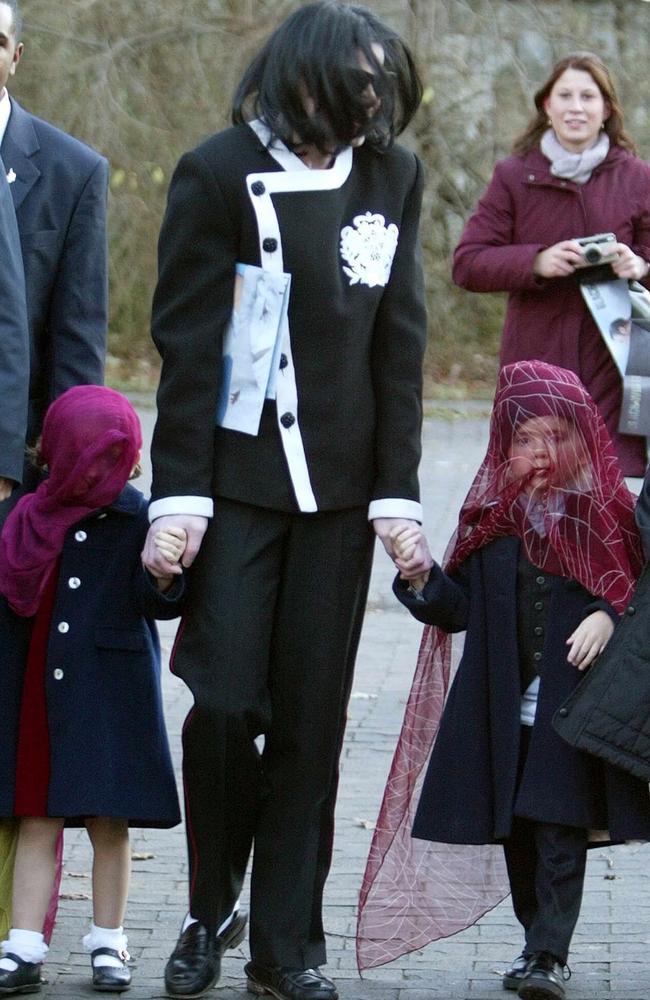 Jackson holds hands of two of Paris &amp; Prince Michael during their 2002 visit to Berlin. Picture: Jackson/Singer 