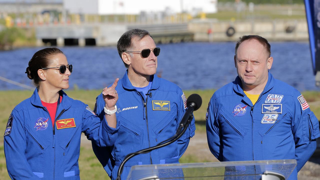 NASA astronaut Nicole Mann (left), Boeing astronaut Chris Ferguson (centre) and NASA astronaut Mike Fincke will be the first crew to fly on the Starliner spacecraft some time next year. Picture: AP Photo/Terry Renna