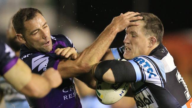 Gallen runs full steam into Storm and Maroons legend Cameron Smith. Picture: Mark Evans