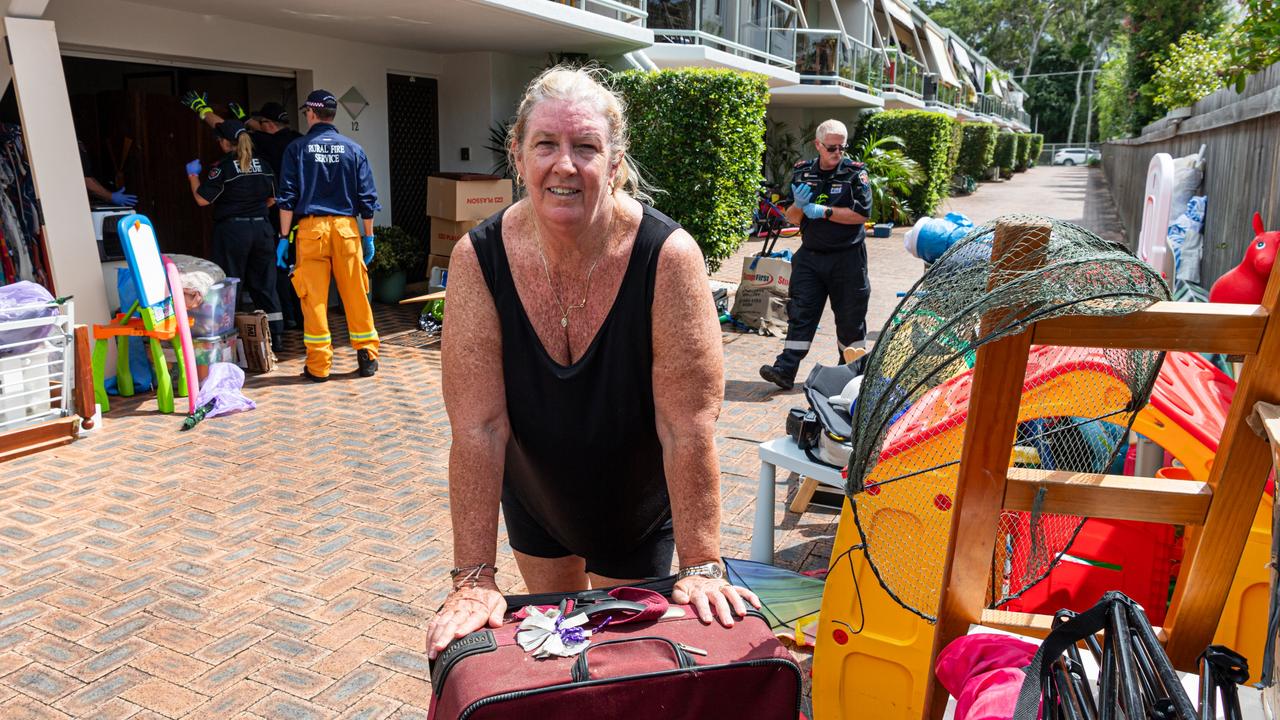Hervey Bay’s Tracey Bell and the rural fire brigade help clean up in Freshwater St. Photo Paul Beutel