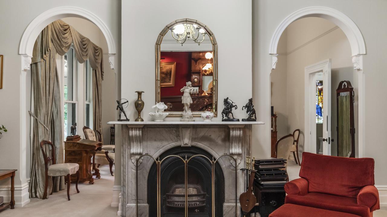 The home has high ceilings and arched hallways.