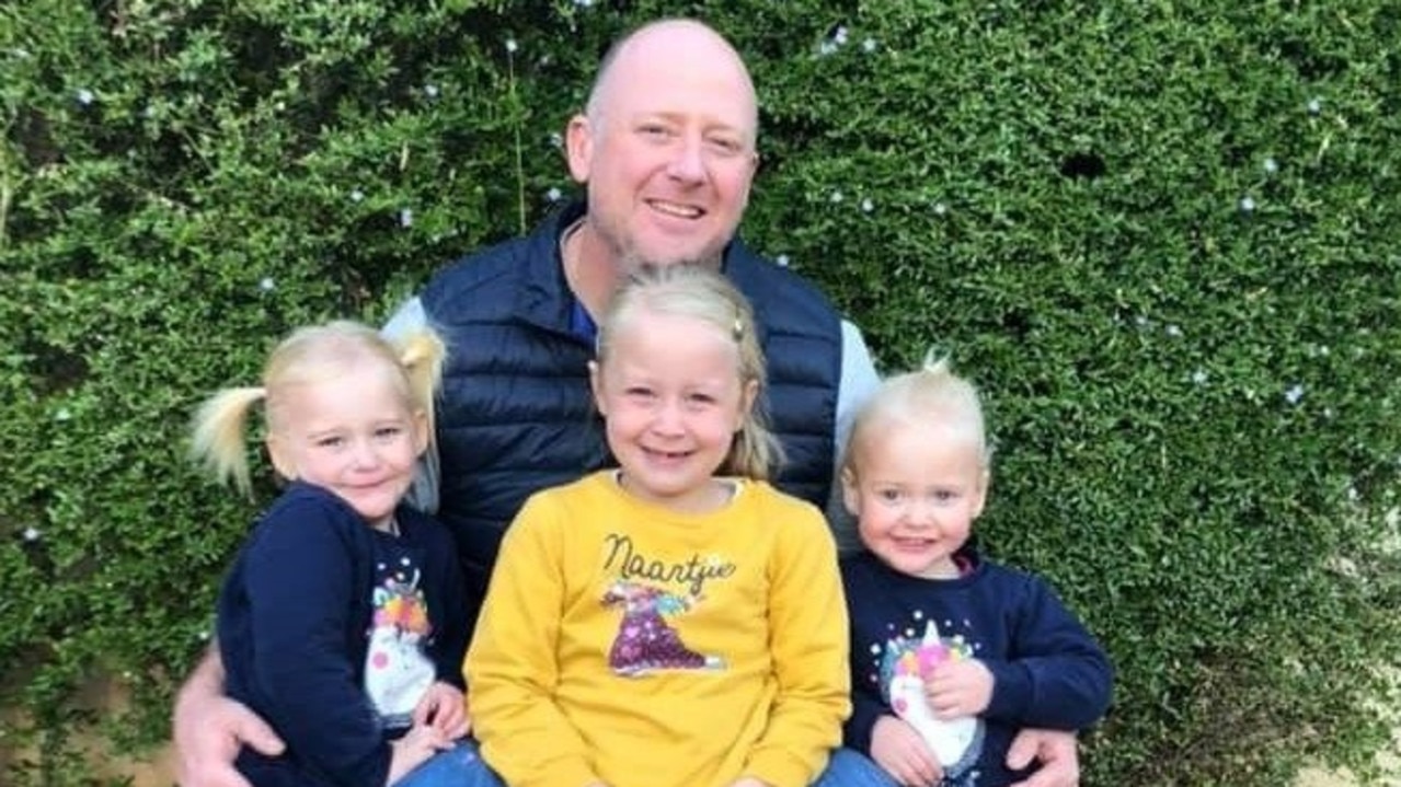 Dr Graham Dickason with daughters, Liane, centre, and twins Maya and Karla.