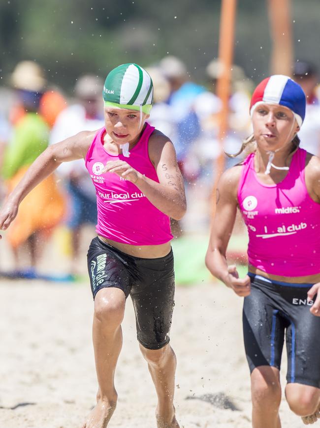 Mona Vale’s Tobias Woolnough (L) brings his team home for third place in the under-10 Male Board Relay semi-final at the NSW Surf Life Saving Championships at Blacksmiths Beach on Friday, 28 February, 2020. Picture: Troy Snook