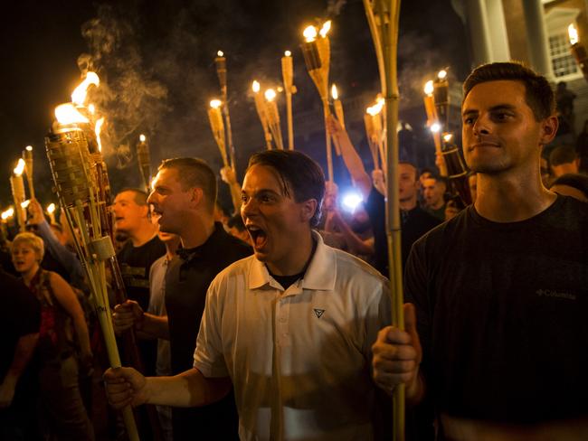 Protesters held torches during evening rally. Picture: Samuel Corum/Anadolu Agency/Getty Images