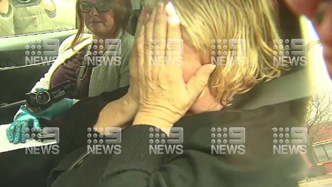 Rosemary Maione, the carer of Ann Smith, is taken into the city watch-house to be charged with Ms Smith’s manslaughter. Picture Nine News