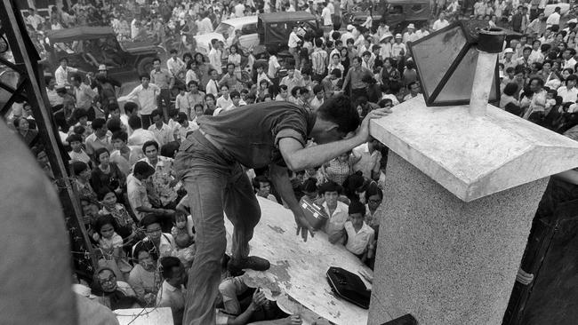 South Vietnamese civilians try to scale the 14-foot wall of the U.S. embassy in Saigon, trying to reach evacuation helicopters as the last Americans departed from Vietnam. More than two bitter decades of war in Vietnam ended with the last days of April 1975