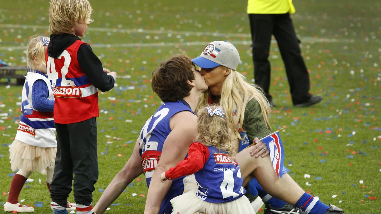 Picken kisses wife Annie on the MCG after the 2016 premiership win. Picture: David Caird