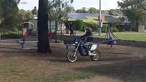 A dirt bike rider metres from the playground on Marston Drive in Morphett Vale. 