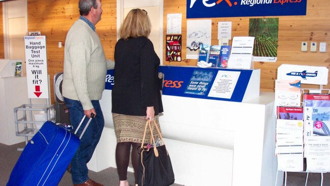 Passengers checking-in with Rex Airlines, in the outdated Mount Gambier Airport.