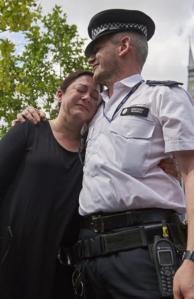 SA woman Gill Hicks, a survivor of the 7/7 London terror attacks, embraces one of the police officers who saved her life. Picture: AFP/Niklas Hallen