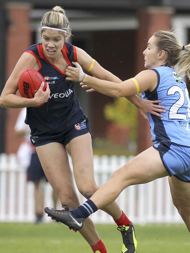 Norwood's Monique Hollick attempts to break away from Sturt’s Lauren Lovell during a clash earlier this year. Picture: AAP/Dean Martin